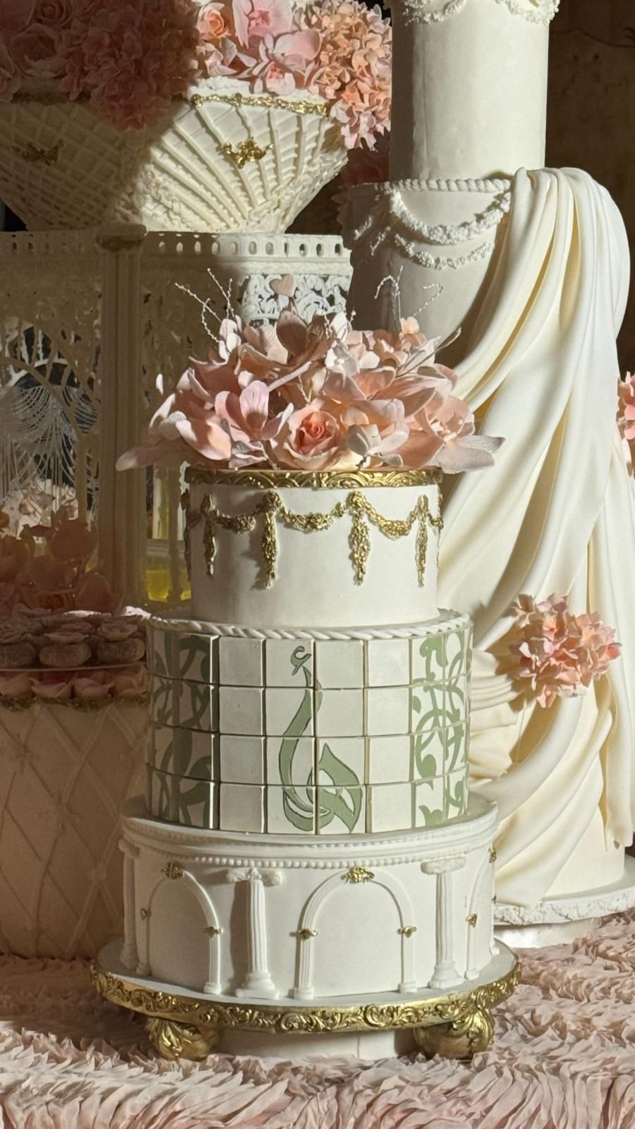 Hand Painted Towers with arabic calligraphy and golden touches, crafted in qatar all the way to riyadh. Perfect for enagegemts and wedding sweet corners